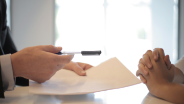 handing-over-papers-to-sign