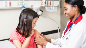 doctor-putting-bandaid-on-child-arm