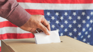 hand casting their vote