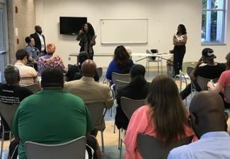 OAG employees speak at community meeting